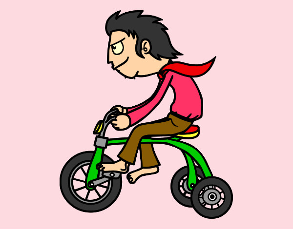 Chico en triciclo