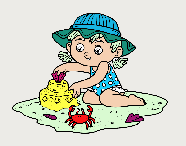 Una niña jugando en la playa