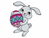 Dibujo Conejo con huevo de pascua pintado por Potte