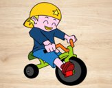 Niño en triciclo