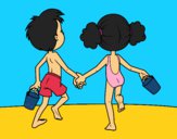 Niña y niño en la playa