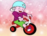 Niño en triciclo
