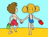 Niña y niño en la playa