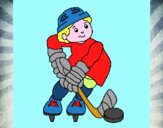 Niño jugando a hockey