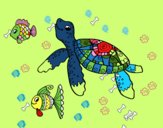 Tortuga de mar con peces