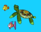 Tortuga de mar con peces