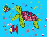 Tortuga de mar con peces