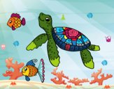 Tortuga de mar con peces