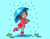 Niña con paraguas bajo la lluvia