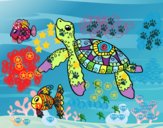 Tortuga de mar con peces