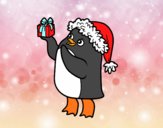 Pingüino con gorro y regalo de Navidad