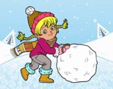 Niña con gran bola de nieve