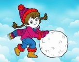 Niña con gran bola de nieve