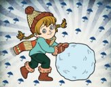 Niña con gran bola de nieve