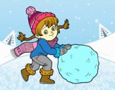 Niña con gran bola de nieve