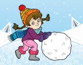 Niña con gran bola de nieve