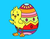 Pollito simpático con huevo de Pascua