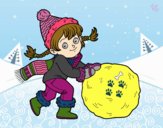 Niña con gran bola de nieve