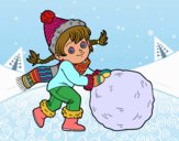 Niña con gran bola de nieve