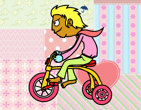 Chico en triciclo
