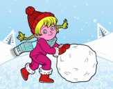 Niña con gran bola de nieve