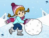 Niña con gran bola de nieve