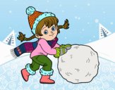 Niña con gran bola de nieve