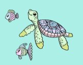 Tortuga de mar con peces