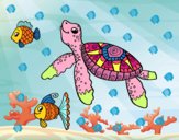 Tortuga de mar con peces