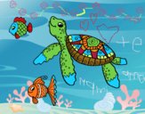 Tortuga de mar con peces