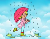 Niña con paraguas bajo la lluvia