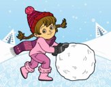 Niña con gran bola de nieve