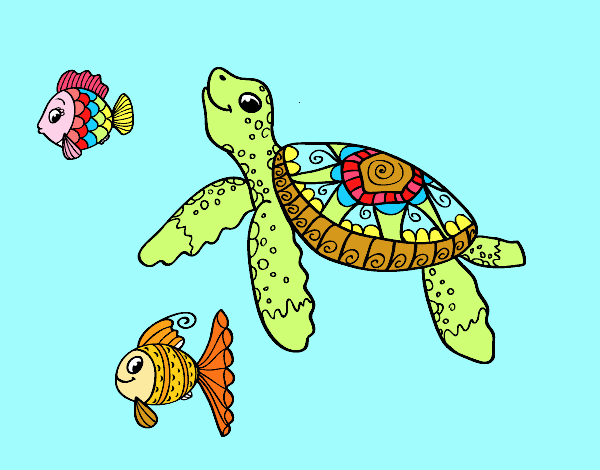 Tortuga de mar con peces