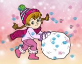 Niña con gran bola de nieve