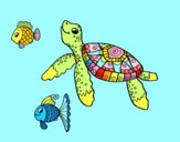 Tortuga de mar con peces