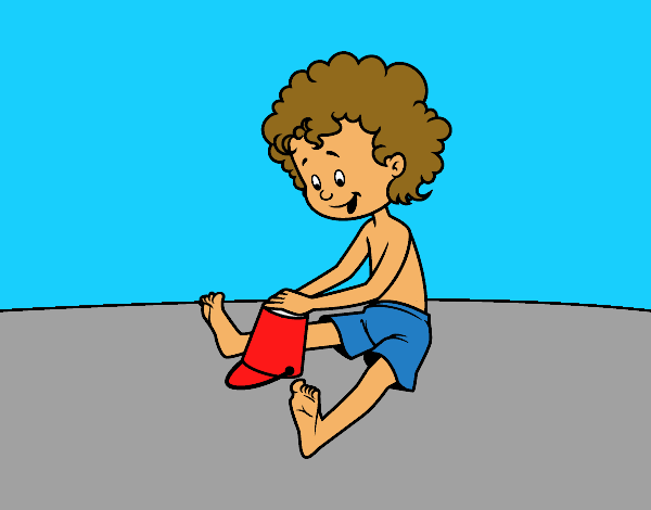 Niño jugando en la arena