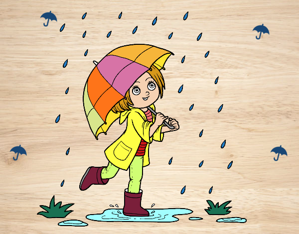 Niña con paraguas bajo la lluvia