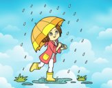 Niña con paraguas bajo la lluvia