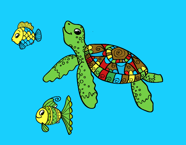 Tortuga de mar con peces