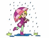 Niña con paraguas bajo la lluvia