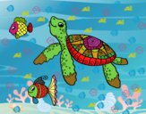 Tortuga de mar con peces