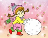 Niña con gran bola de nieve