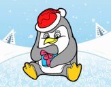 Un pingüino con regalo de Navidad