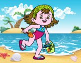 Niña con cubo y pala de playa