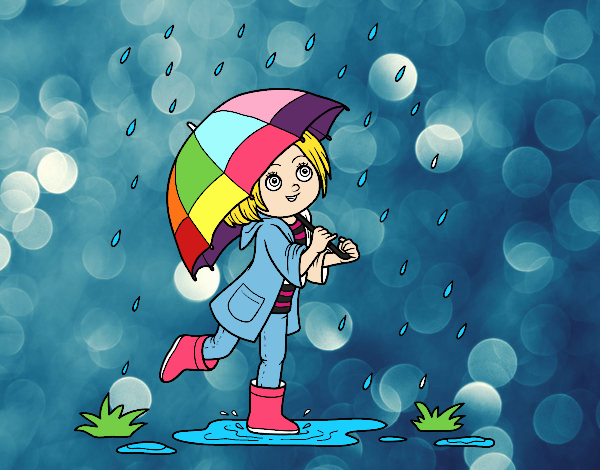 Niña con paraguas bajo la lluvia