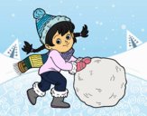 Niña con gran bola de nieve